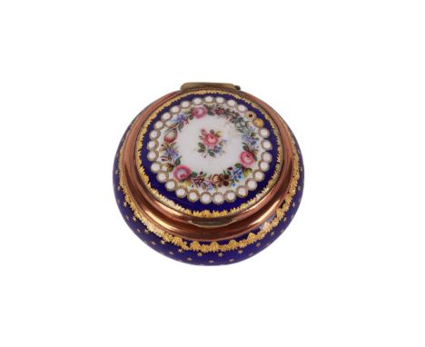 A 19th century enamel box and cover decorated with flowers and gilding on a blue ground, 5.5cms diameter.Condition ReportGene