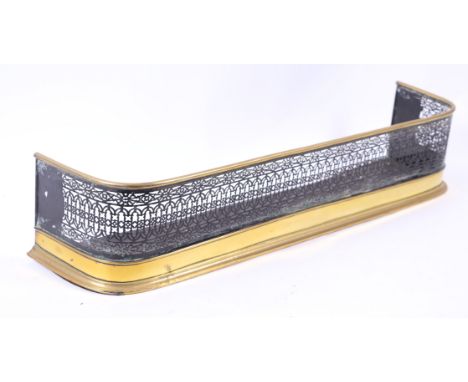A 19th century pierced steel and brass fire fender, 99cms wide. Condition Report 99cm wide, 28cm deep and 21cm high,