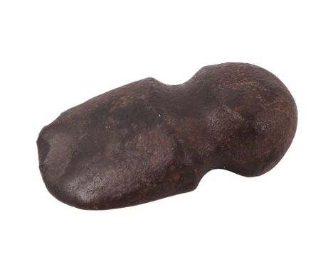A carved stone axe / war club head of typical form, worked from dense igneous rock, probably North American Indian, 14 by 9cm