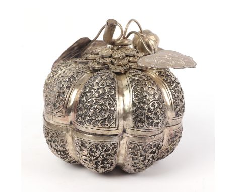 A Chinese silver coloured metal box and cover in the form of a pumpkin, 14cms high.
