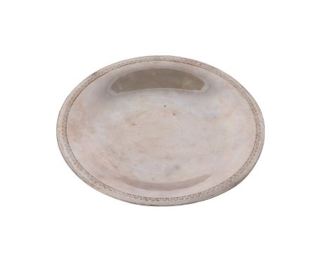 An Egyptian silver shallow dish, 22cms diameter, 255g.