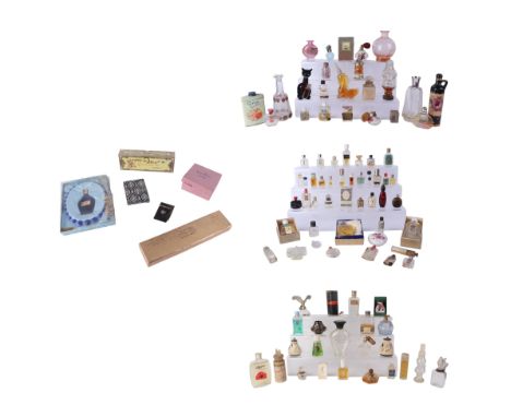 A large quantity of vintage glass scent bottles, some with original contents.
