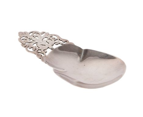 An ornate silver caddy spoon with pierced handle, Sheffield 1897 and makers mark for Mappin & Webb, 10.5cms long, 26g.