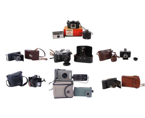 A group of vintage cameras to include Kodak, Ensign, Zenit and Polaroid.