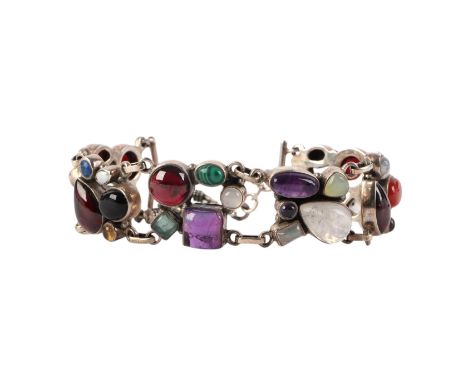 A 925 silver bracelet set with semi precious stone cabochons to include amethysts and garnets.