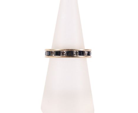 A 14ct gold, sapphire and white stone eternity ring, approx UK size K, 3.3g.