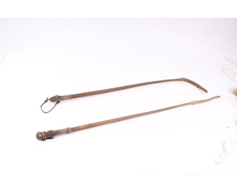 A 19th century continental silver and yellow metal handled riding crop, 70cms long; together with another similar with contin