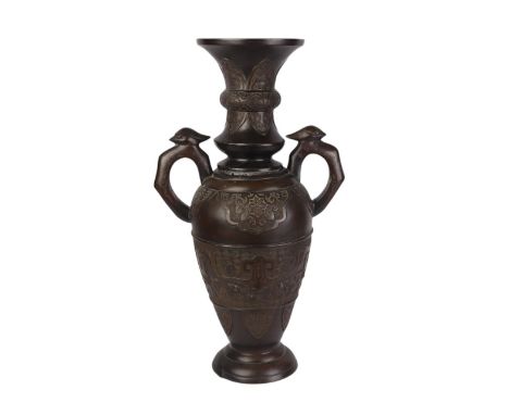 A large Chinese / Japanese bronze two-handled vase with white metal inlay in the archaic style, 61cms high.Condition ReportTh