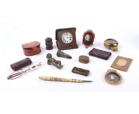 An oval porcelain portrait miniature depicting a young boy; together with a bone Stanhope pencil; a brass vesta case; and oth