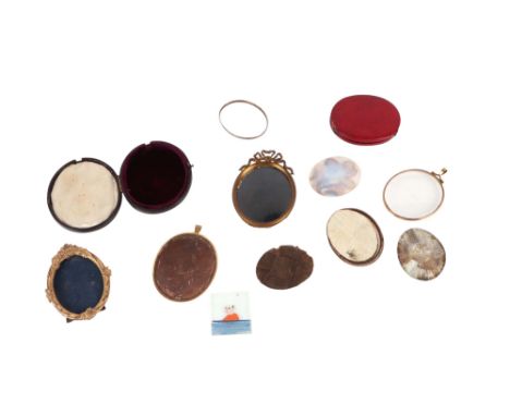 A group of antique portrait miniature cases, glazed frames and two ormolu oval frames.