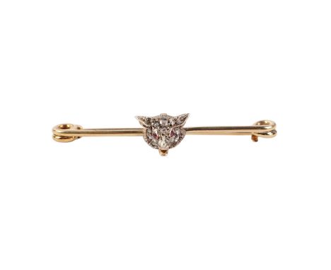 A Victorian yellow metal fox head bar brooch set with old cut diamonds and ruby eyes, boxed, 5cms wide, 3.9g.