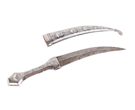 An Iraqi silver coloured metal dagger with niello decoration to the handle and scabbard, with 18cm curved steel blade.