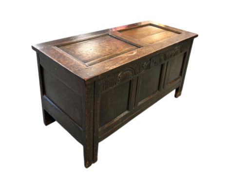 A late 18th / early 19th century panelled oak coffer, 111cms wide.Condition ReportThere are replacement hinges and lock, knoc