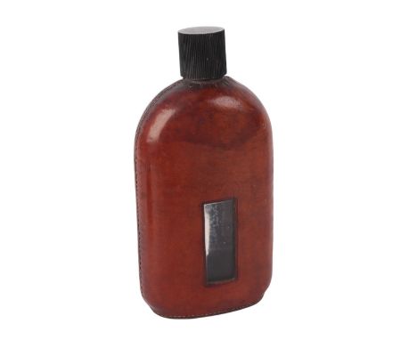 Hunting & shooting interest:  A glass spirit flask with leather cover, 20cms high.
