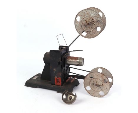 A Bing film projector with twelve tins of film.