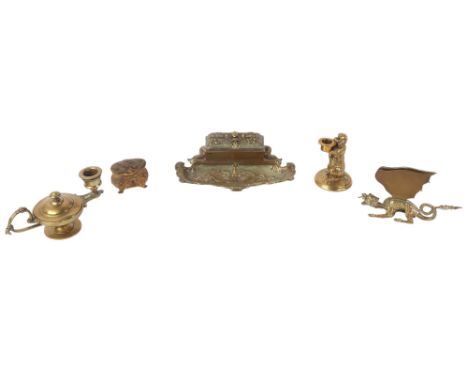 A Victorian brass desk stand, the top opening to reveal two blue glass inkwells, 21cms wide; a brass begging dog match holder