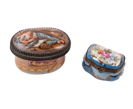 A continental porcelain snuff box, the lid decorated with a recumbent lady reading a book, the internal lid decorated with a 