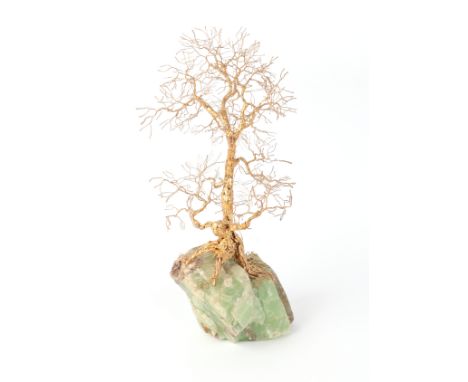 Patrick Drinkwater (1937-2024) - A golden tree sculpture, a tree with a human figure as part of the trunk, on green quartz ba