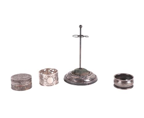 An Edwardian silver hat pin stand; together with a continental silver box and cover; a silver napkin ring; a silver bookmark 