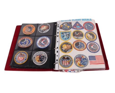 A large collection of vintage Airforce and Army cloth patches, American Space Mission patches and decals, contained in an alb