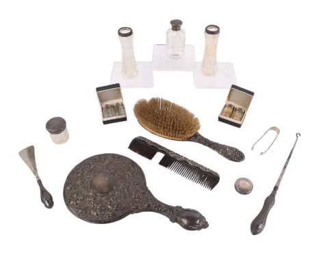 A silver backed hand mirror; together with a silver backed brush; a pair of silver mounted cut glass vases; silver topped pep