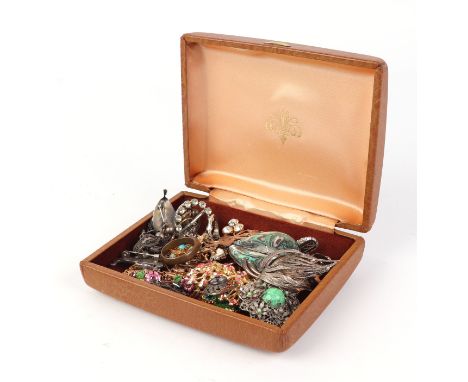 A quantity of costume jewellery to include silver brooches and rings.