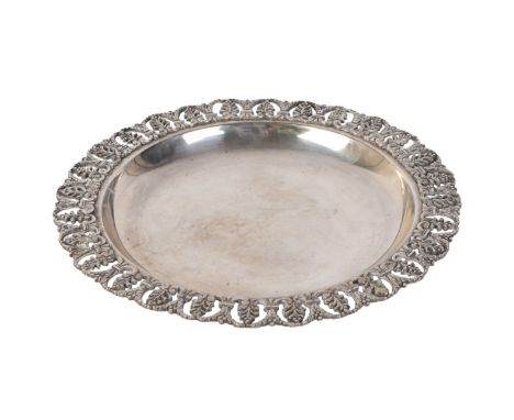 An Egyptian silver dish with pierced rim, 26cms diameter, 578g.