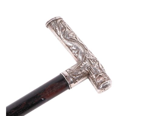 An ebonised walking cane with Chinese silver coloured metal handle and bamboo repousse decoration, 86cms long.