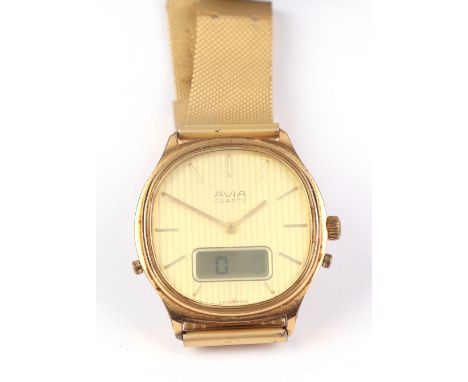 A 1970's Avia quartz LCD and analogue watch, on a bracelet strap and original box.