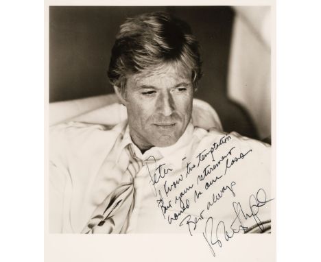 * Redford (Robert, 1936-). A signed and inscribed photograph, head and shoulders portrait wearing a light jacket and tie, sig