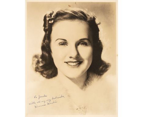 * Durbin (Deanna, 1921-2013). A vintage signed and inscribed sepia photograph, a close-up head portrait, signed in blue ink f