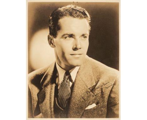 * Fonda (Henry, 1905-1982). A vintage signed publicity photograph, head and shoulders portrait wearing jacket and tie, signed