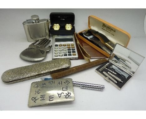 A digital wristwatch, a pair of watch cufflinks, a flask belt buckle, etc.