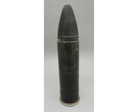 A rubber bullet 1.5" baton round