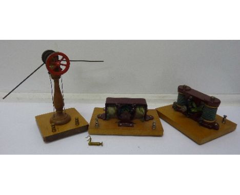 Two model motors and a model engine belt wheel