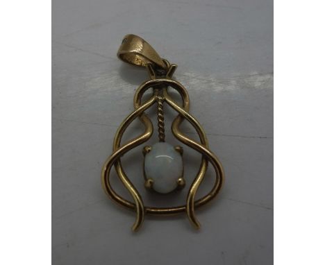 An 18ct gold and opal pendant, weight 2.1g