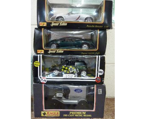 Four model vehicles including two Maisto, boxed