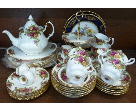 Royal Albert Old Country Roses china including a cake plate, six cups and saucers, bowls, a teapot, sugar and cream, etc., an