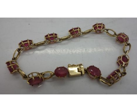 A 9ct gold and ruby bracelet, total weight 9.9g
