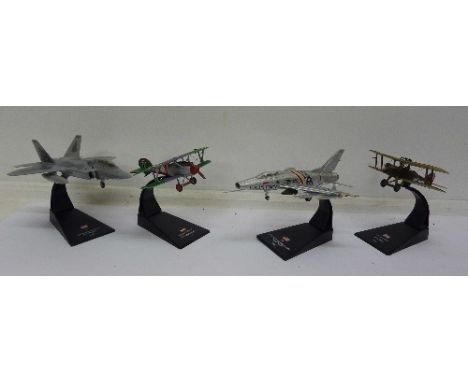 A collection of seventeen die-cast model aircraft on stands