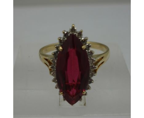 An 18ct gold, ruby and diamond ring, weight 4.6g, size O