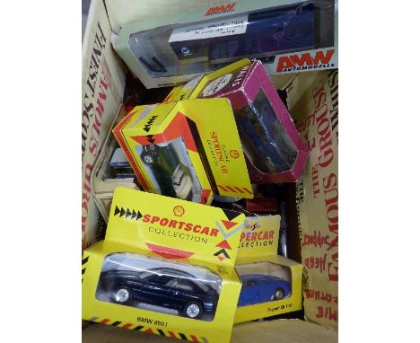 A collection of die-cast model vehicles, boxed and loose
