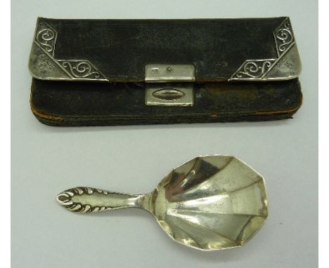 A silver mounted purse and a silver caddy spoon