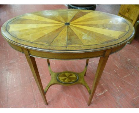 AN OVAL TOPPED MAHOGANY TABLE with multi-wood fan inlay and boxwood stringing on square tapering supports and shaped under ti