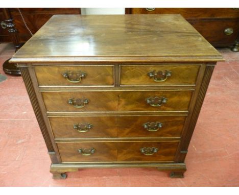 A NEAT REPRODUCTION MAHOGANY CHEST of two short over three long drawers having shaped backplates and swing handles with cockb