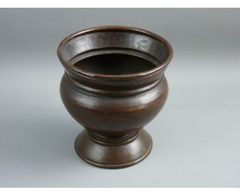 A 19th CENTURY BEATEN COPPER PLANTER, urn shaped with foldover rim, hammered finish with bronzed patina, the base with painte