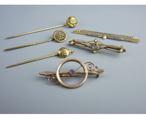 TWO GOLD BAR BROOCHES and another dart and circle brooch, believed gold, total 5.2 grms, a yellow metal stick pin (1914-1918)