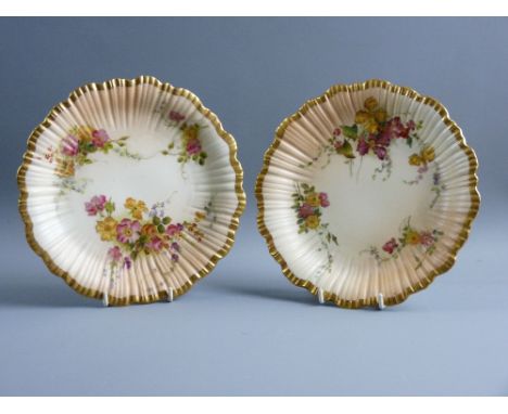 A PAIR OF ROYAL WORCESTER 1416 PATTERN CIRCULAR PLATES with rib pattern and wavy borders with gilt highlighting, decorated wi