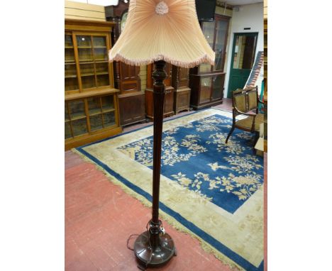 A GOOD CARVED WALNUT STANDARD LAMP WITH SHADE