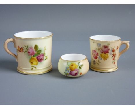 THREE ROYAL WORCESTER CABINET PIECES with handpainted floral patterns on a blush ground including a 4 cms high mug, a 3.5 cms